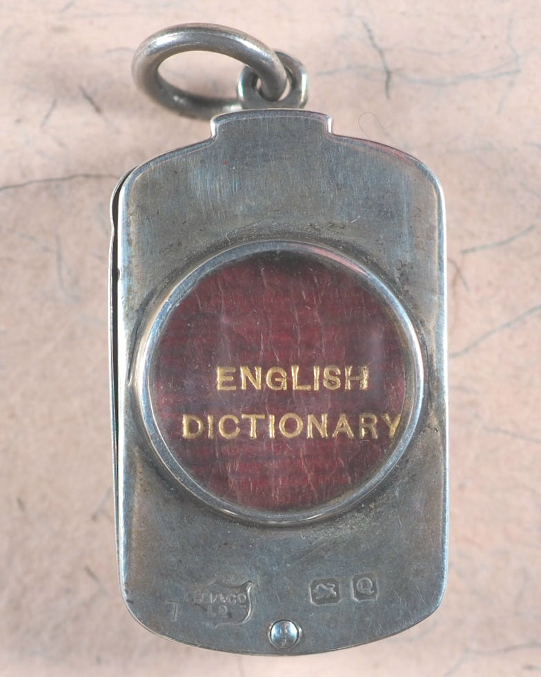 Smallest English Dictionary in the World. Comprising: besides the ordinary & newest words in the language, short explanations of a large number of scientific, philosophical, literary & technical terms. Bryce, David & Son. Glasgow. 1893. SILVER LOCKET